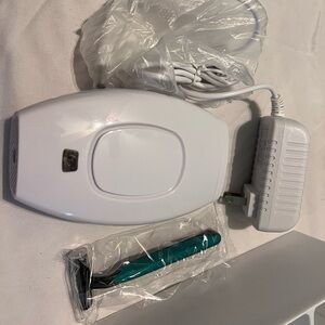 White Hair Removal Device with Teal Razor